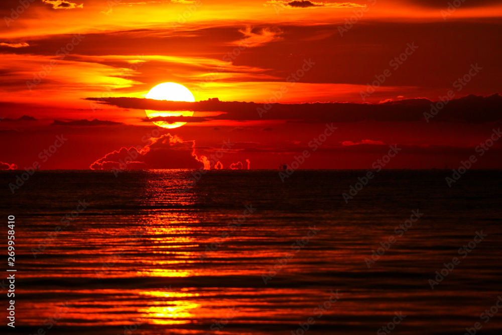 sunset on sea and ocean last light red sky silhouette cloud