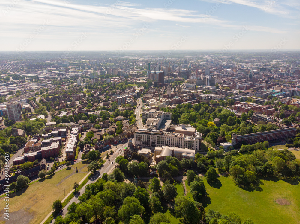 Obraz premium Aerial photo of the town known as Headingley in Leeds West Yorkshire, you can see the Leeds university in the background and the Leeds City Centre taken with a drone on a beautiful sunny day.