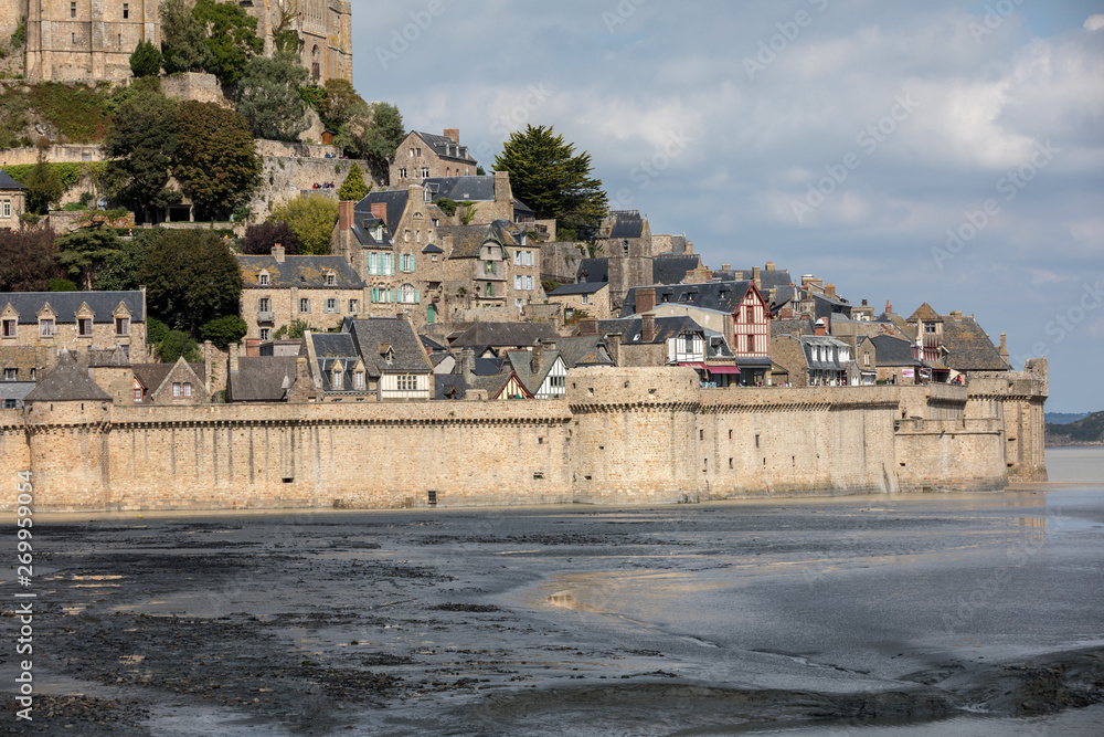 Fototapeta premium Le Mont Saint-Michel, medieval fortified abbey and village on a tidal island in the Normandy, France, at low tide