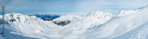 Fototapeta Naklejka Na Ścianę i Meble -  Panoramic view across snow covered alpine mountain range