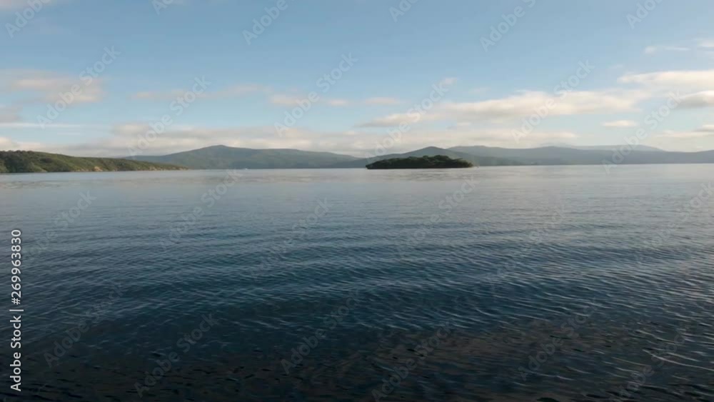 View from a boat on the Malborough Sound. Driving towards a lone island. Near Picton, New Zealand. Wide Angle dolly 2 View from a boat on the Malborough Sound. Driving towards a lone island. Near Picton, New Zealand. Wide Angle dolly 2