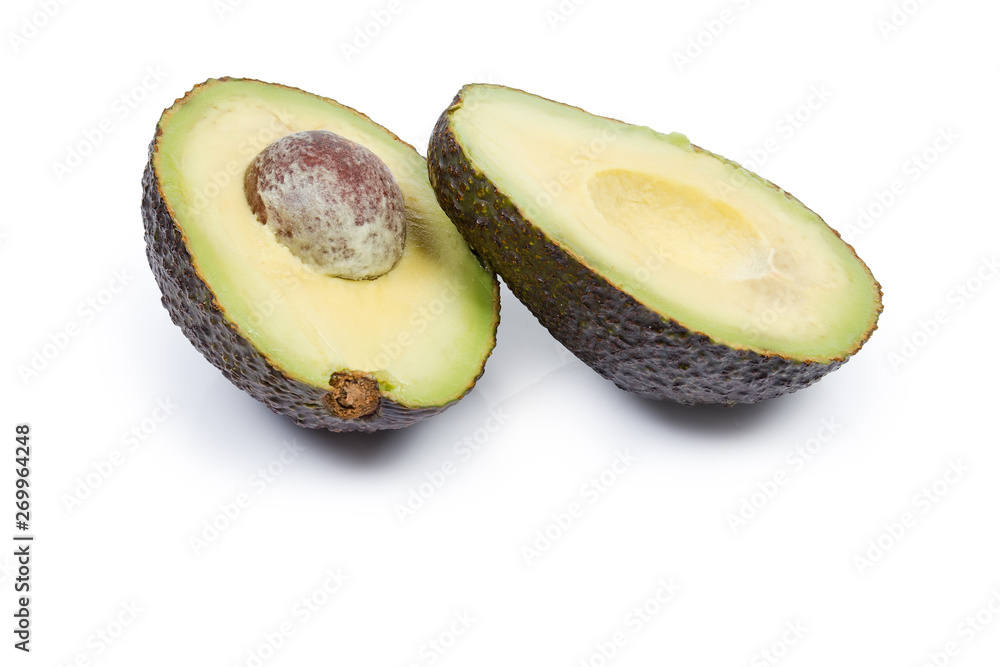 Brown avocado cut in half on a white background
