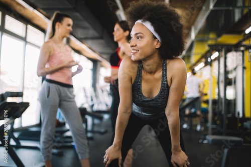 Close up image of attractive fit woman in gym