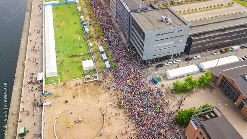 Canvas Print Marathon running race, aerial view of start and finish line with many runners fr