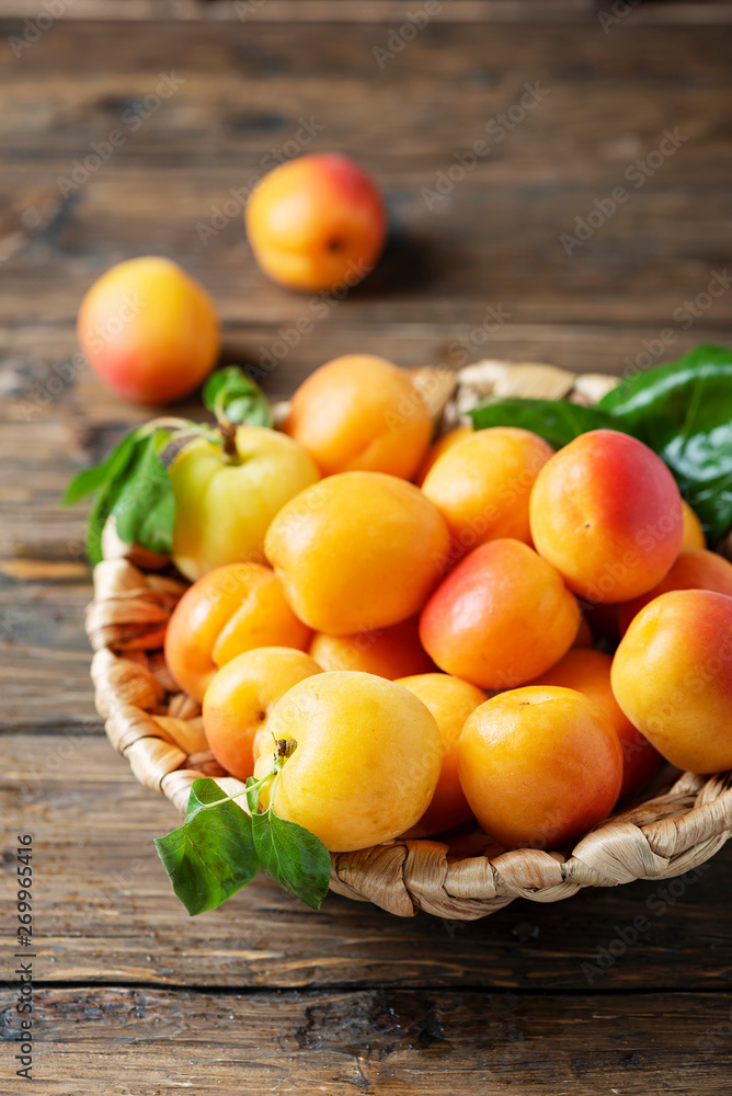 Sweet apricots on the wooden table Sweet apricots on the wooden table