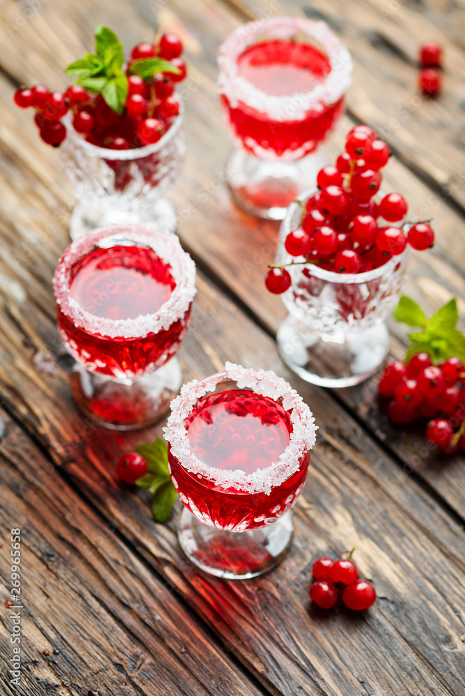 Red currant liquor with sugar and mint Red currant liquor with sugar and mint