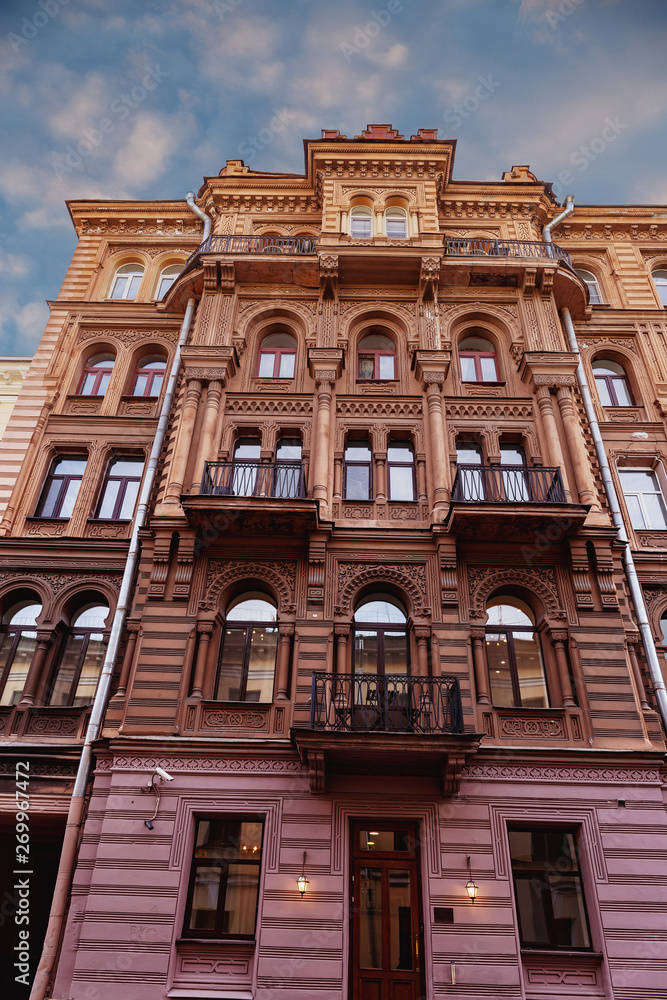 Fototapeta premium a building, richly decorated carved in stone in the historic center of the city of St. Petersburg, Russia
