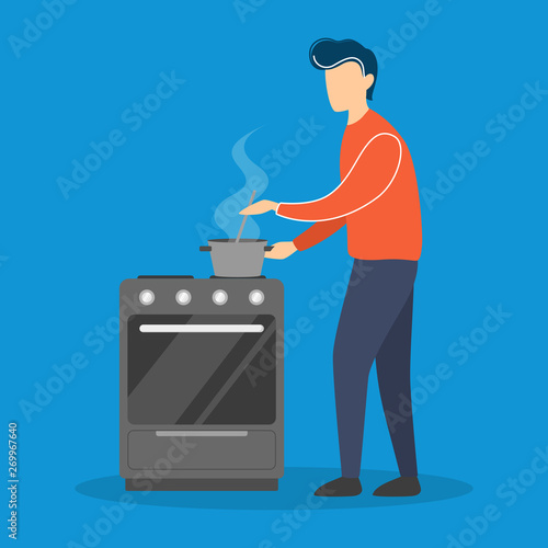 Young man cooking in the kitchen photo