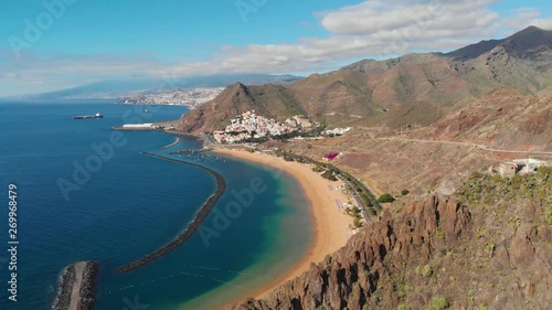 Cinematic Drone Aerial of Playa De Las Teresitas Beach in San Andres Tenerife Canary Island With Sand From Sahara Desert and Waves Defence Pier 4k photo