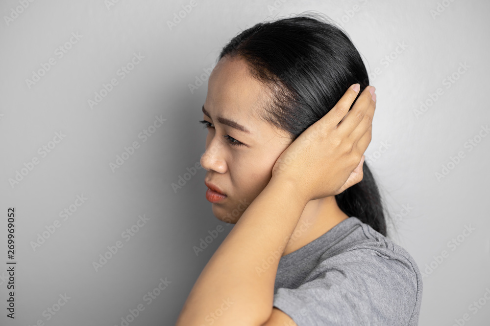 Young woman is suffering of earache. Young woman is suffering of earache.