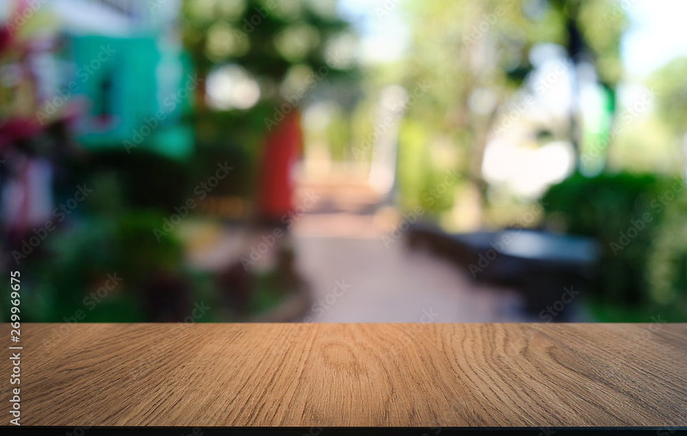 Empty dark wooden table in front of abstract blurred bokeh background of restaurant . can be used for display or montage your products.Mock up for space. Empty dark wooden table in front of abstract blurred bokeh background of restaurant . can be used for display or montage your products.Mock up for space.