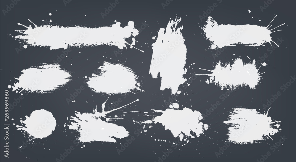 set white ink spots set on black background.