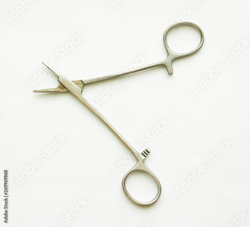 needle holder forceps on white background