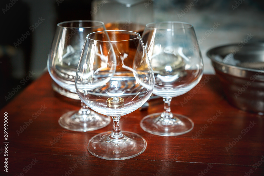 Brandy glass with a wedding ring inside Brandy glass with a wedding ring inside