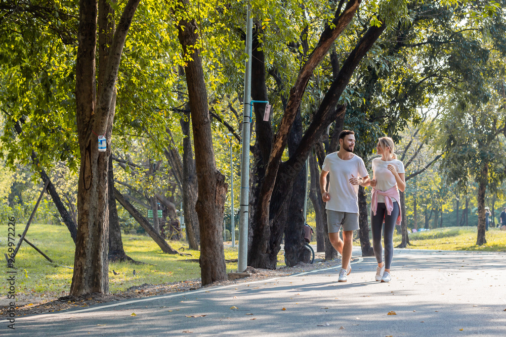 Young couples jogging in the park.