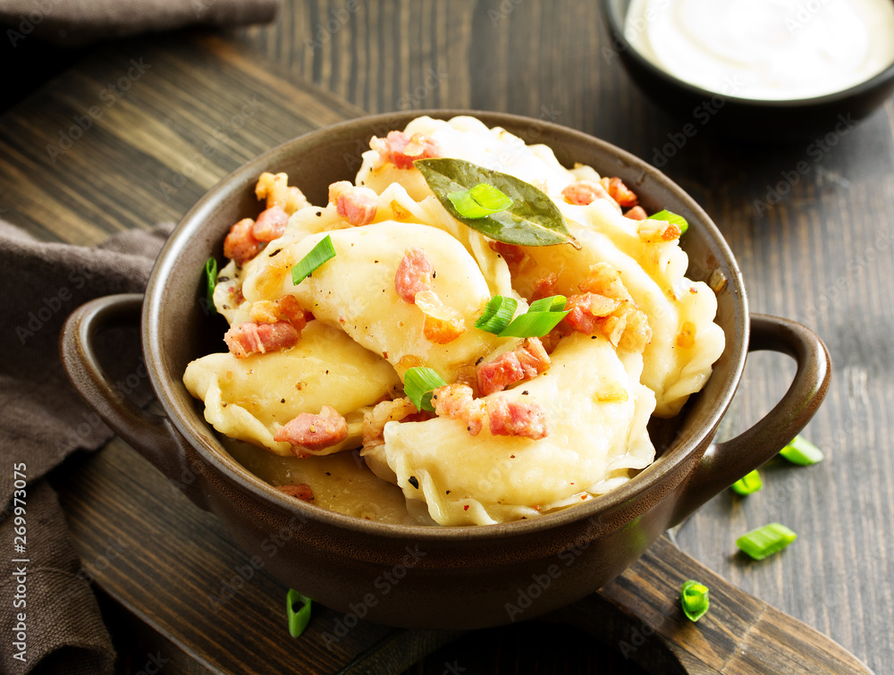 dumplings with potatoes in onion and bacon sauce. Varenyky, vareniki, pierogi, pyrohy. dumplings with potatoes in onion and bacon sauce. Varenyky, vareniki, pierogi, pyrohy.