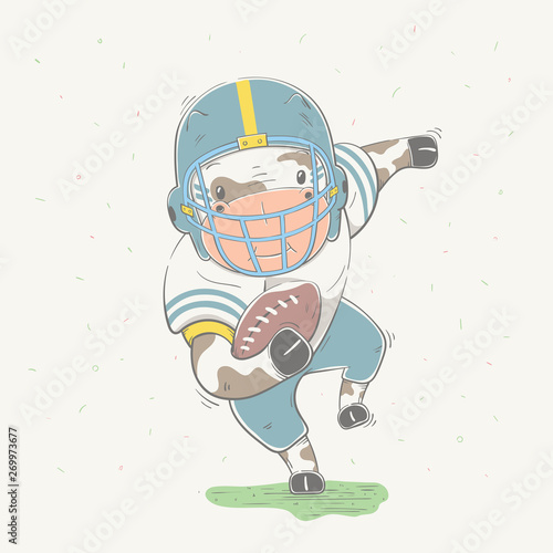 Lovely cute goby dressed like American Football player with ball in field. Young dressed cow.