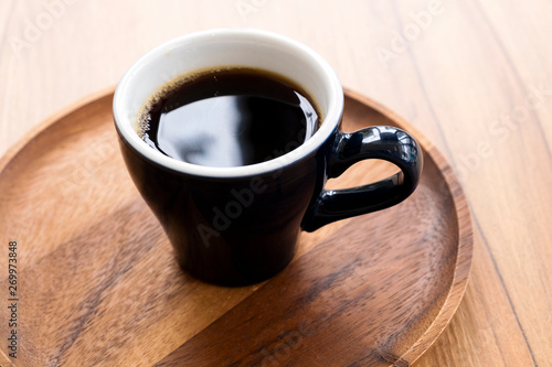 Hot coffee on a wooden table