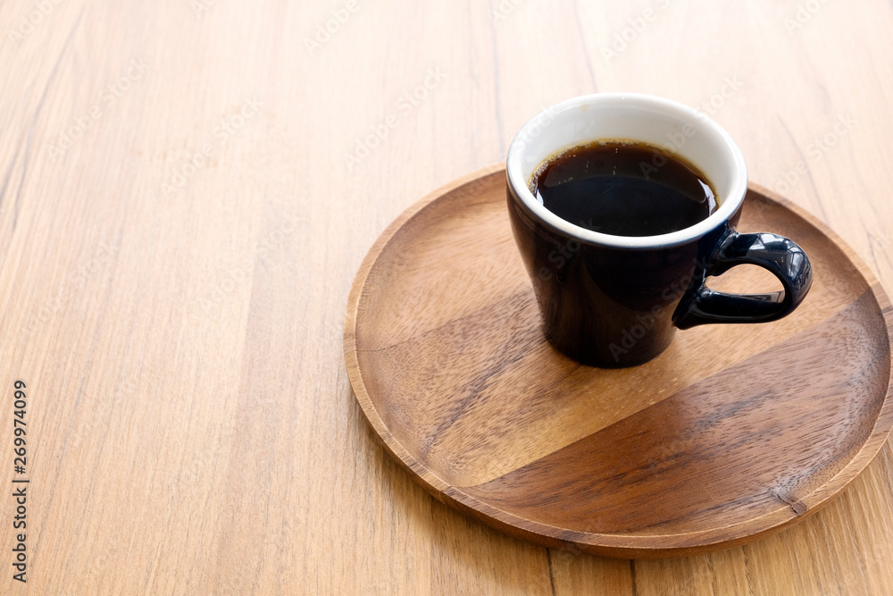 Hot coffee on a wooden table