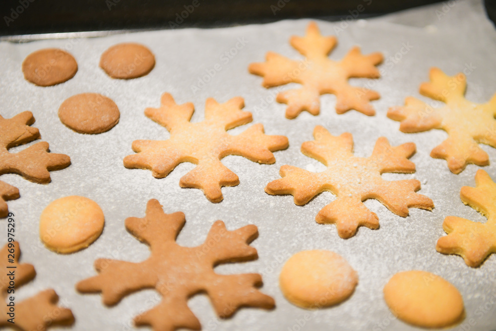 Snowflake Cookies. Snowflake shaped Gingerbread cookies stacked and tied with a gold bow.