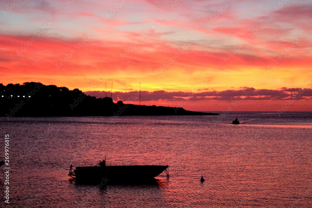 evocative image of fishing boats at sunset in port evocative image of fishing boats at sunset in port
