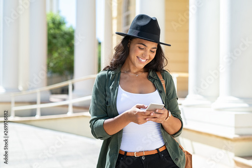 Latin woman using phone