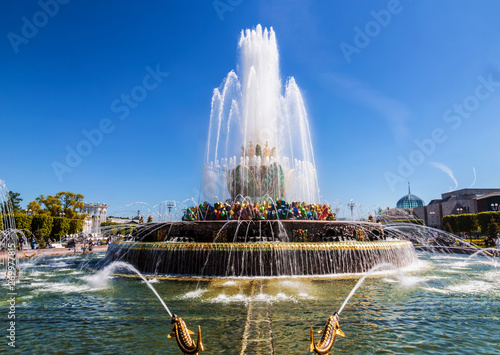 Fountain "Stone flower" on the background of the pavilion "Ukraine" on the territory of the All-Russian exhibition center (VDNH). Moscow, Russia