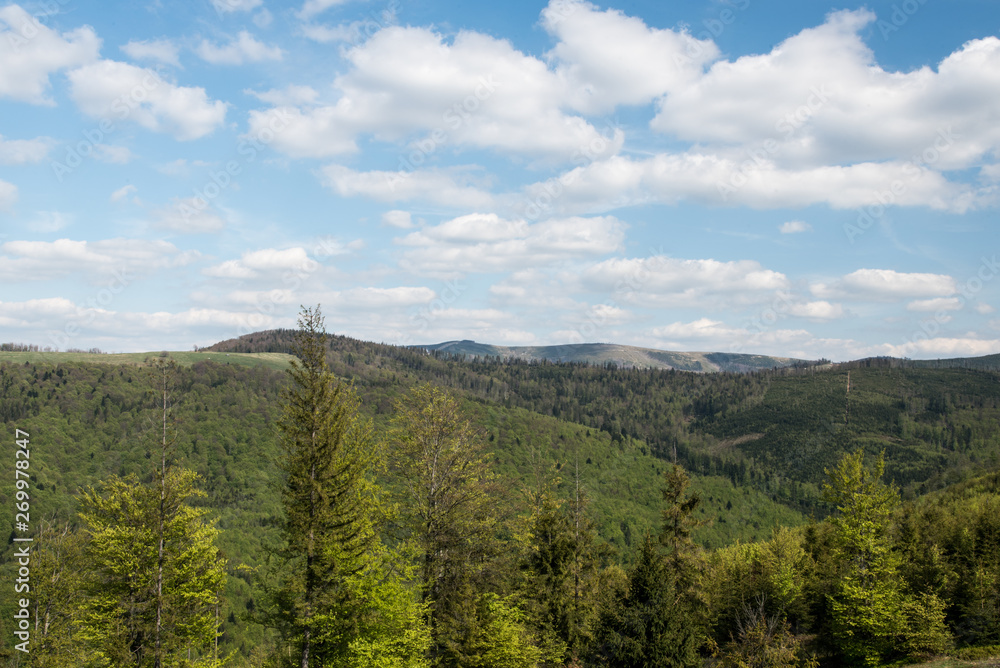 springtime Beskid Slaski mountains from view tower on Stary Gron hill above Brenna village in Poland