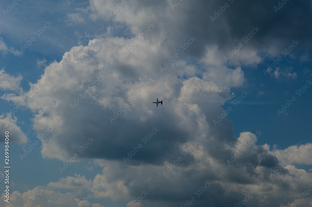 light aircraft against the sky with clouds