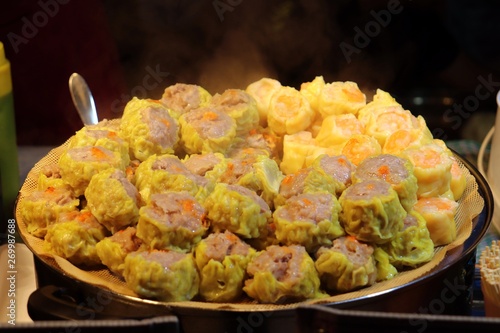 Chinese food, Sui mai stacked on a large plate for sale in night market