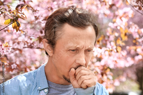 Photos Man having asthma attack outdoors on spring day
