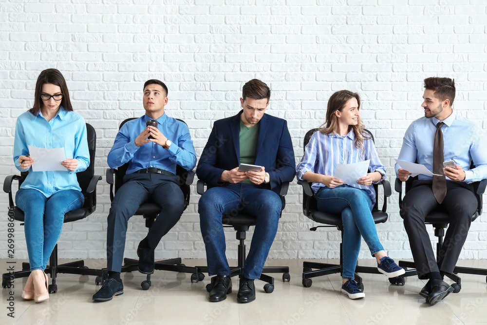 Young people waiting for job interview indoors