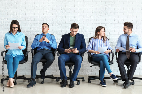 Young people waiting for job interview indoors