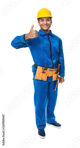 Handsome worker in hardhat showing thumb-up on white background