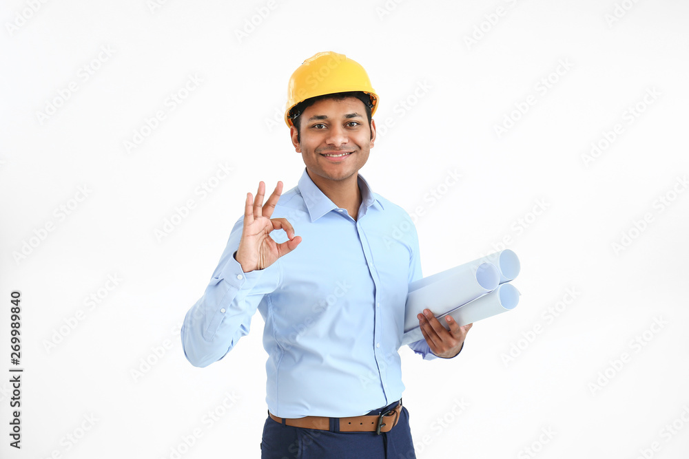 Handsome architect showing OK on white background Handsome architect showing OK on white background