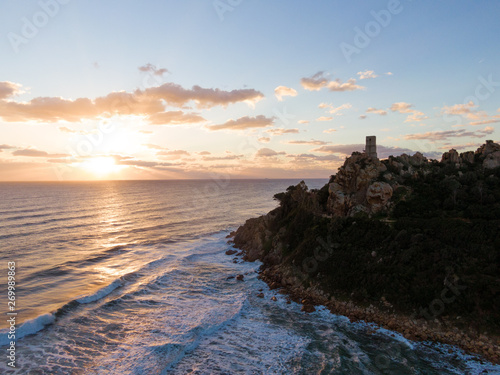 Aerial drone view of Sardinia sea and cliffs at sunset