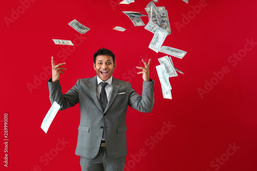 Happy businessman and falli...