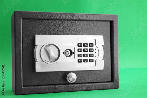 Modern safe on color background © Pixel-Shot