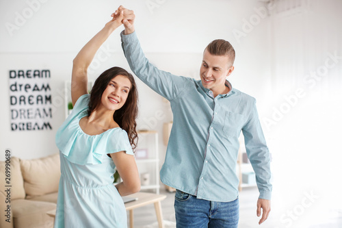 Adorable loving couple dancing at home © Pixel-Shot