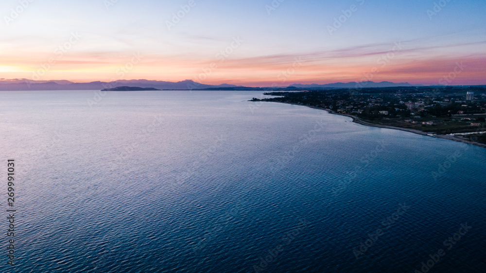Aerial drone view of Sardinia bay at sunset