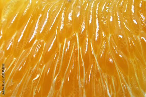 Orange ripe fruit fiber as a backdrop for the design.
