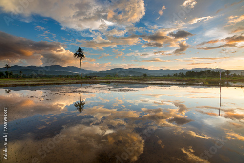 Dramatic sunset reflection in Kota Marudu, Sabah, Malaysia photo