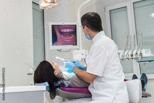 Patient and dentist looking at screen in dentistry