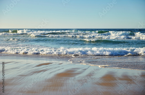 Ocean at sunset with waves photo