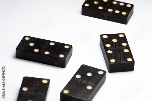 Dominoes standing, in different ways, black.