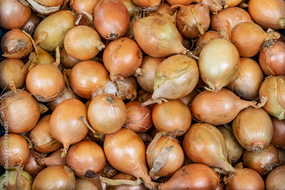 Yellow onion background. Organic biological vegetables in the farmers market. Yellow onion background. Organic biological vegetables in the farmers market.