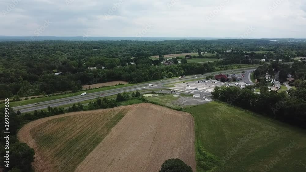 This is an aerial panning drone shot above farmland and a highway in upstate New York. This is an aerial panning drone shot above farmland and a highway in upstate New York.