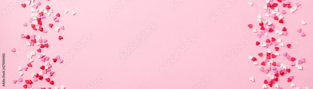 Sugar hearts frame on pink background. Romantic, St Valentines day concept. Top view. Copy space.
