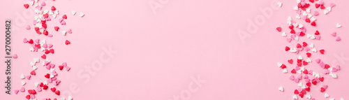 Sugar hearts frame on pink background. Romantic, St Valentines day concept. Top view. Copy space. © annapustynnikova