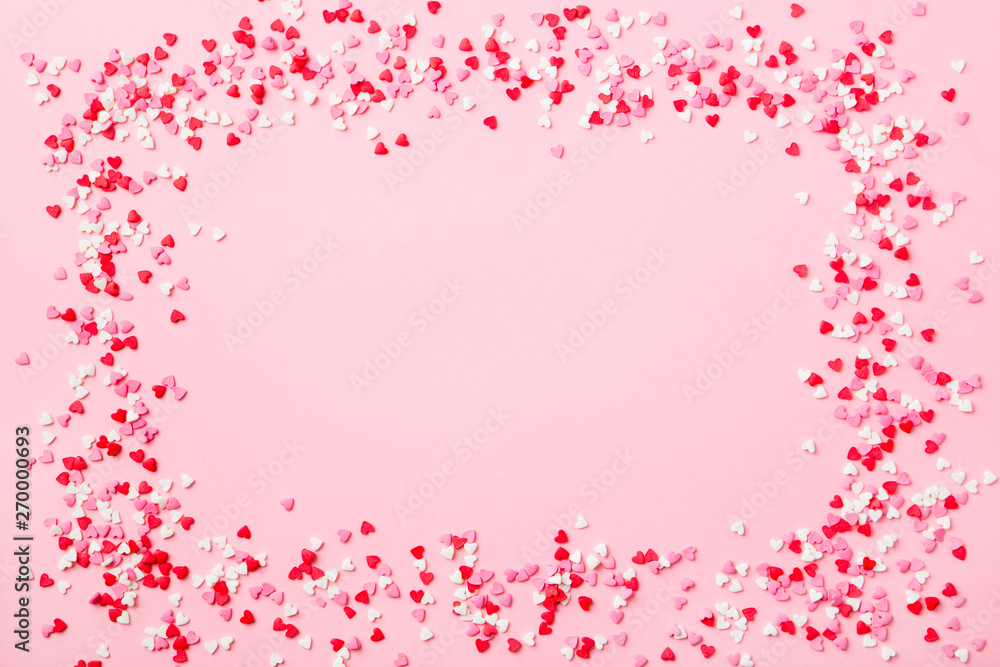 Sugar hearts frame on pink background. Romantic, St Valentines day concept. Top view. Copy space. Sugar hearts frame on pink background. Romantic, St Valentines day concept. Top view. Copy space.